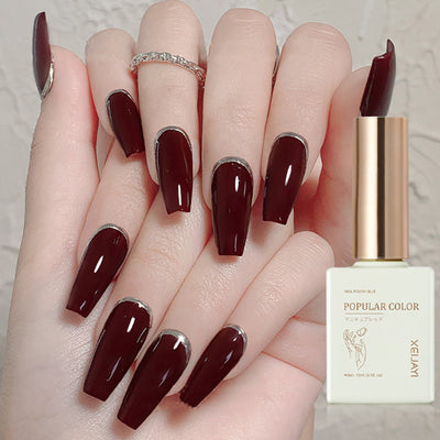 durable wine red UV polish on elegantly manicured nails with a glossy finish and stylish design.